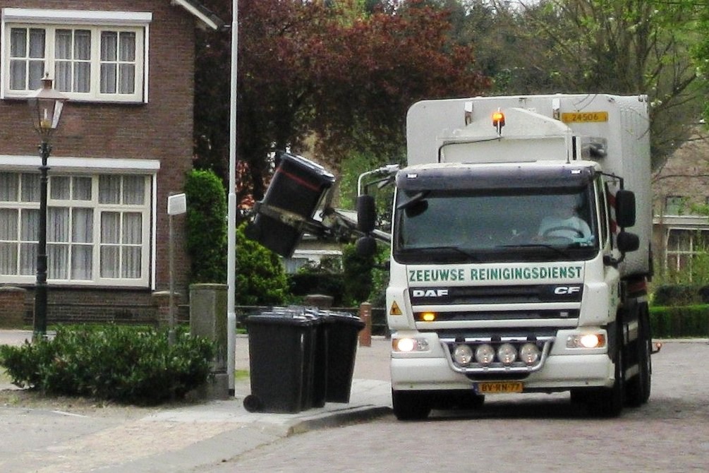 A refuse truck on a residential route. From the kerb, a recycling collection and a refuse collection look identical.
