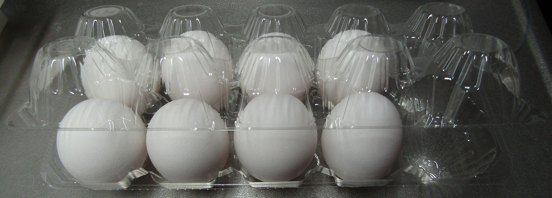A plastic egg carton. Sorting equipment has to decide what this is at belt speed, and PLA looks like PET to most of it.