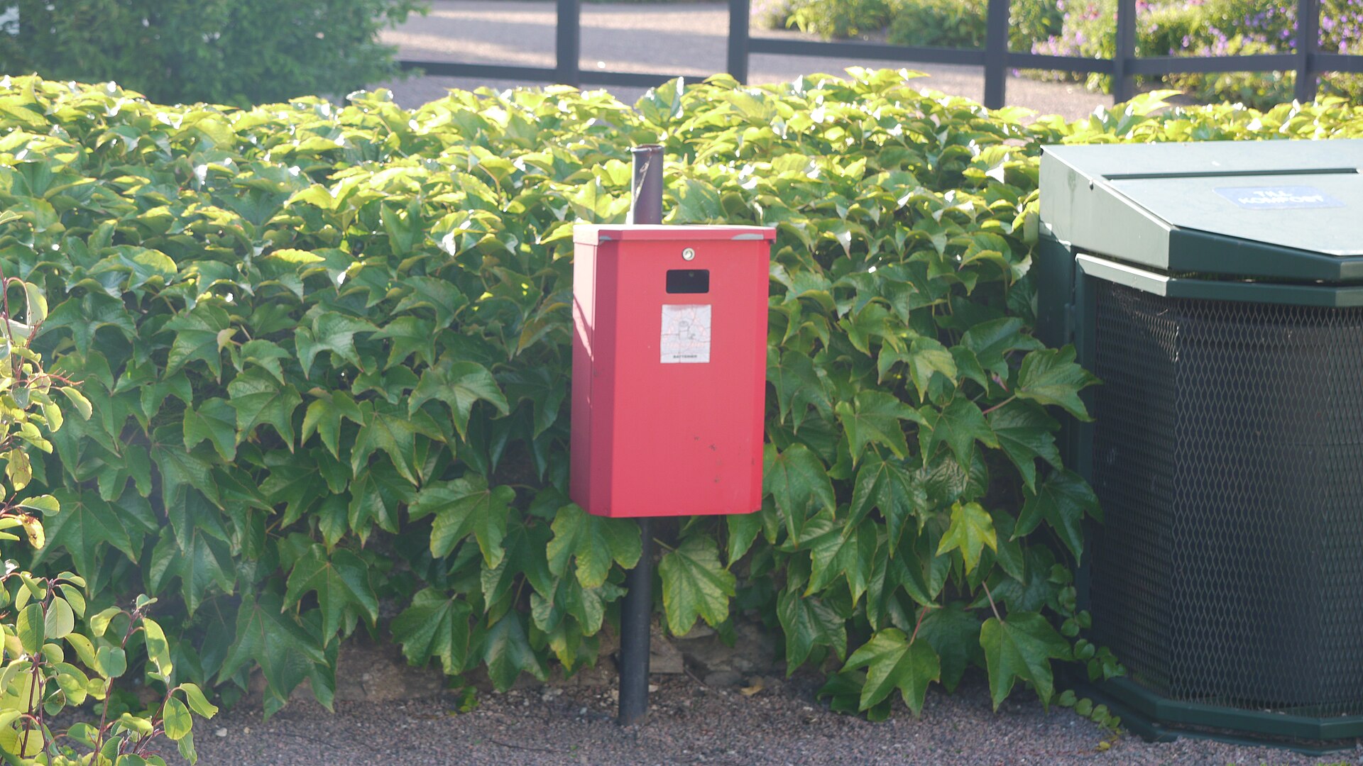 A dedicated collection point. Separate collection is what keeps cells out of compaction equipment and in front of specialist recyclers.