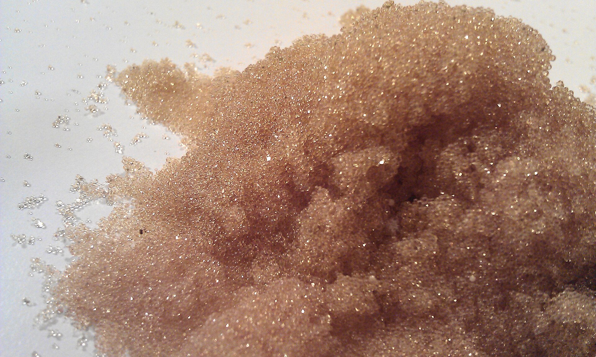 Ion-exchange resin. Selective, effective, and eventually a hazardous waste in its own right.