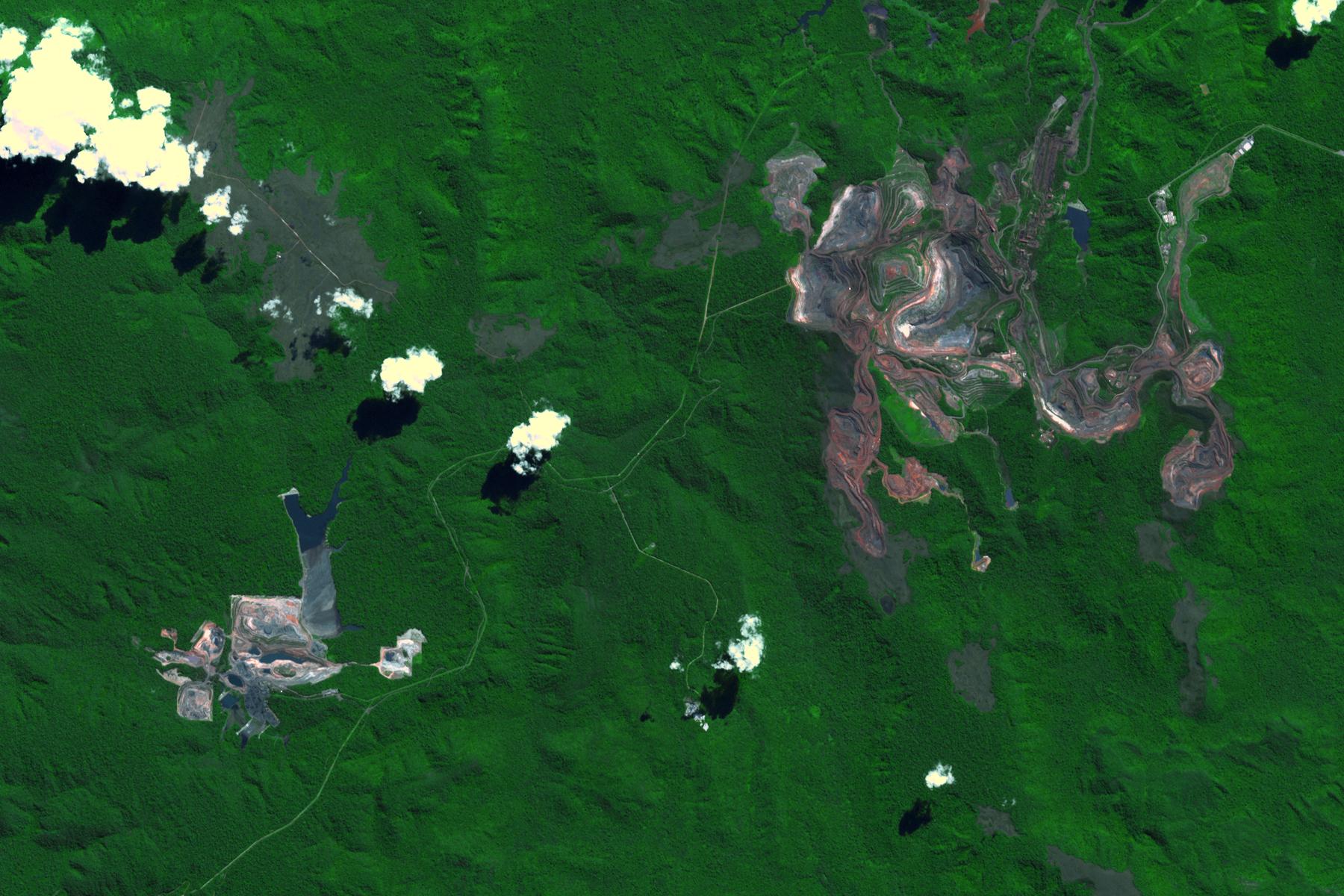 Carajás from orbit. Decades of stored tailings sit alongside active pits.