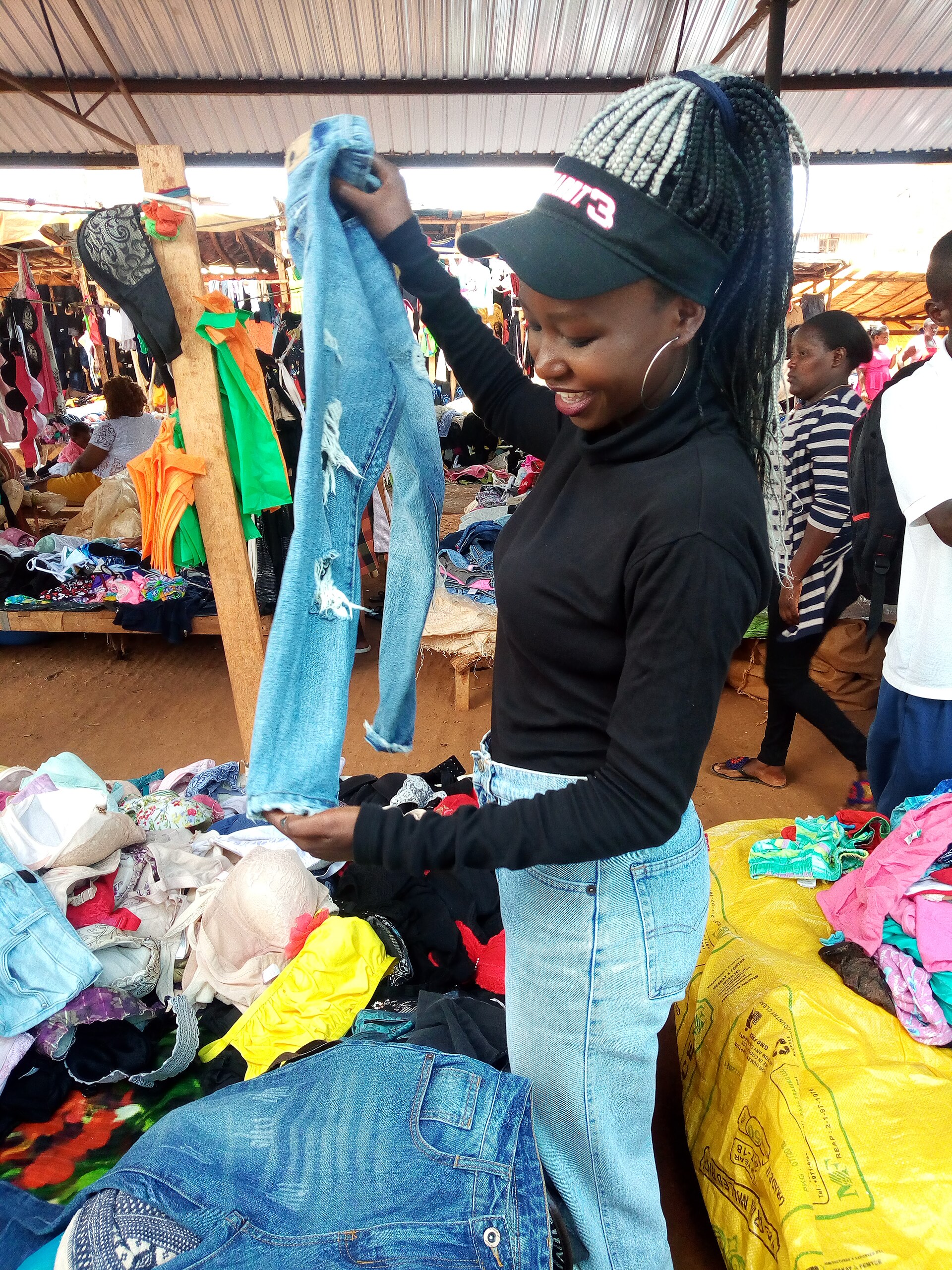 Secondhand trade keeps enormous volumes of clothing in use. It also imports whatever was unsellable in the bale.