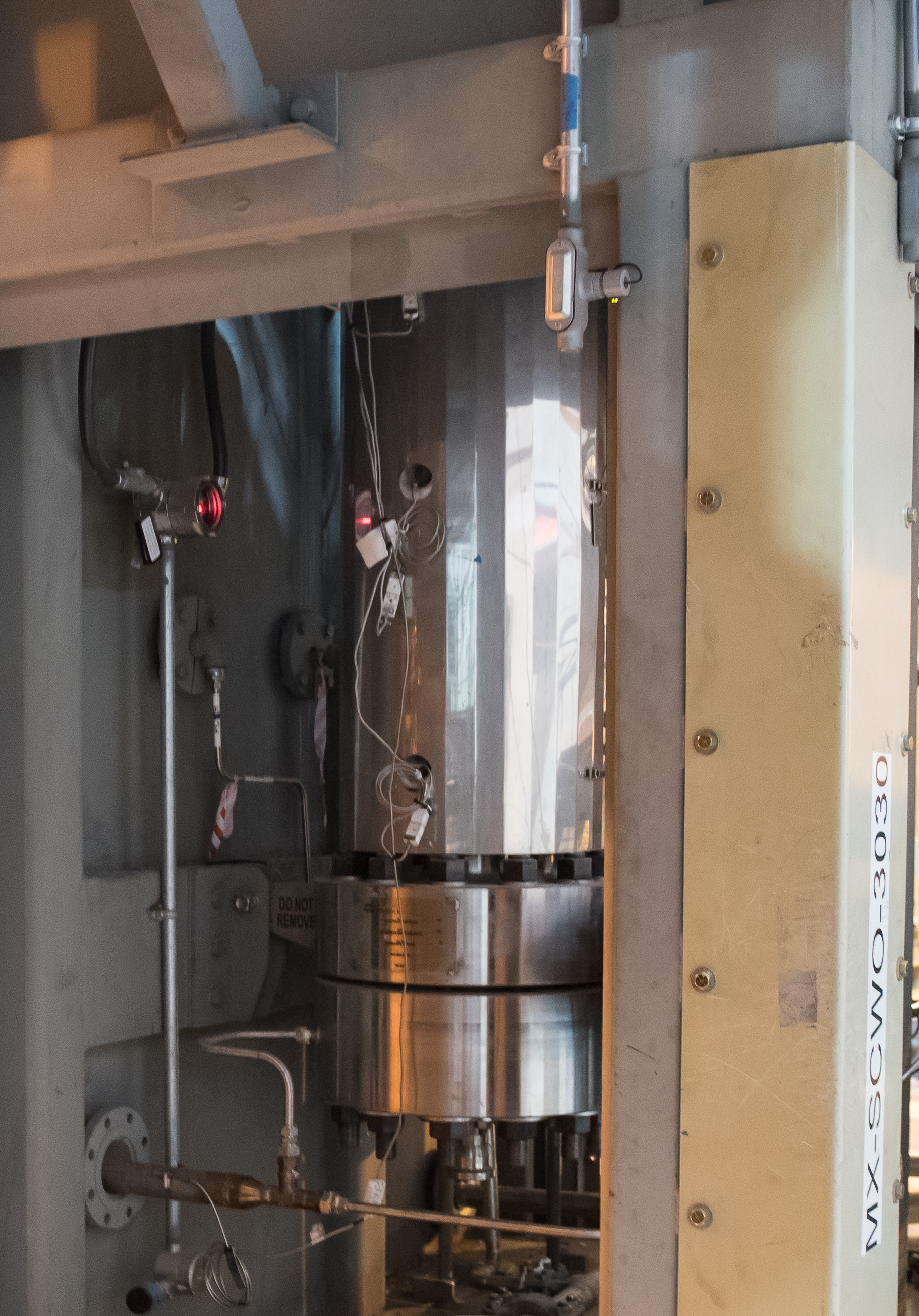 The plant around the reactor: feed preparation, heat recovery, effluent handling. Most of the cost lives here.