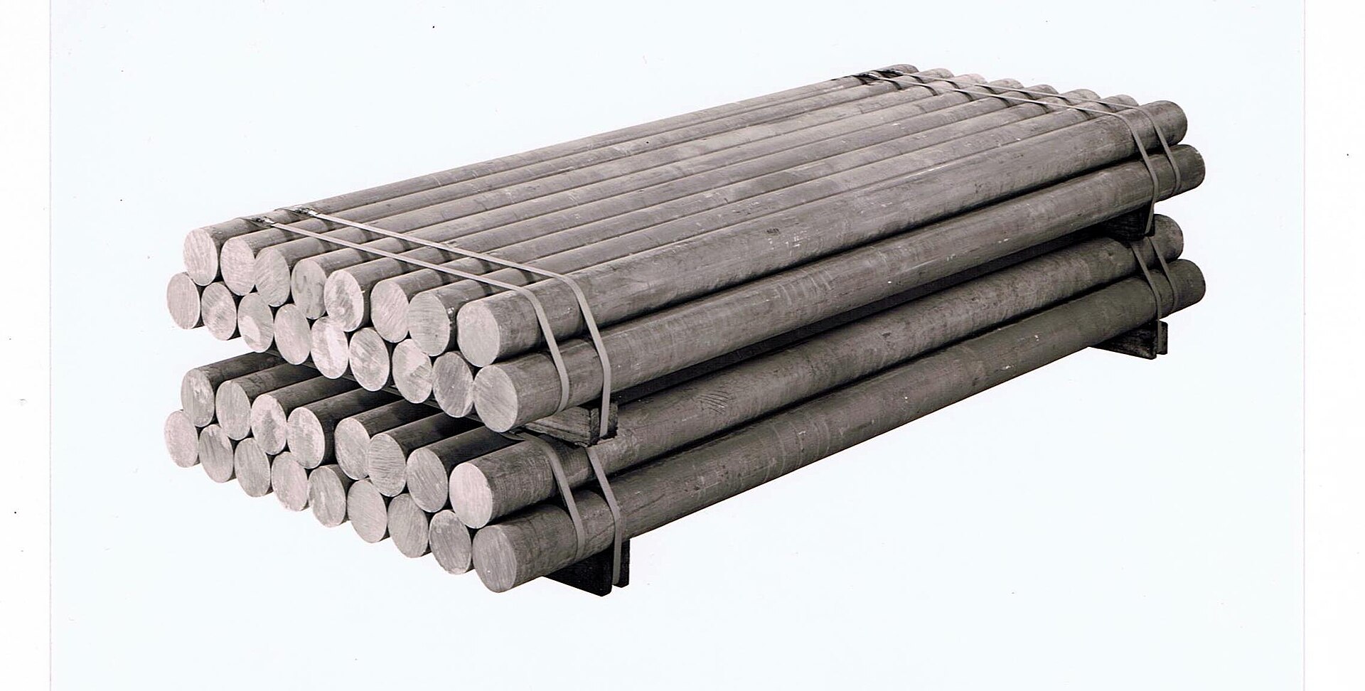 Cast aluminium billets. Remelting scrap to this point uses a small fraction of the energy of smelting ore.