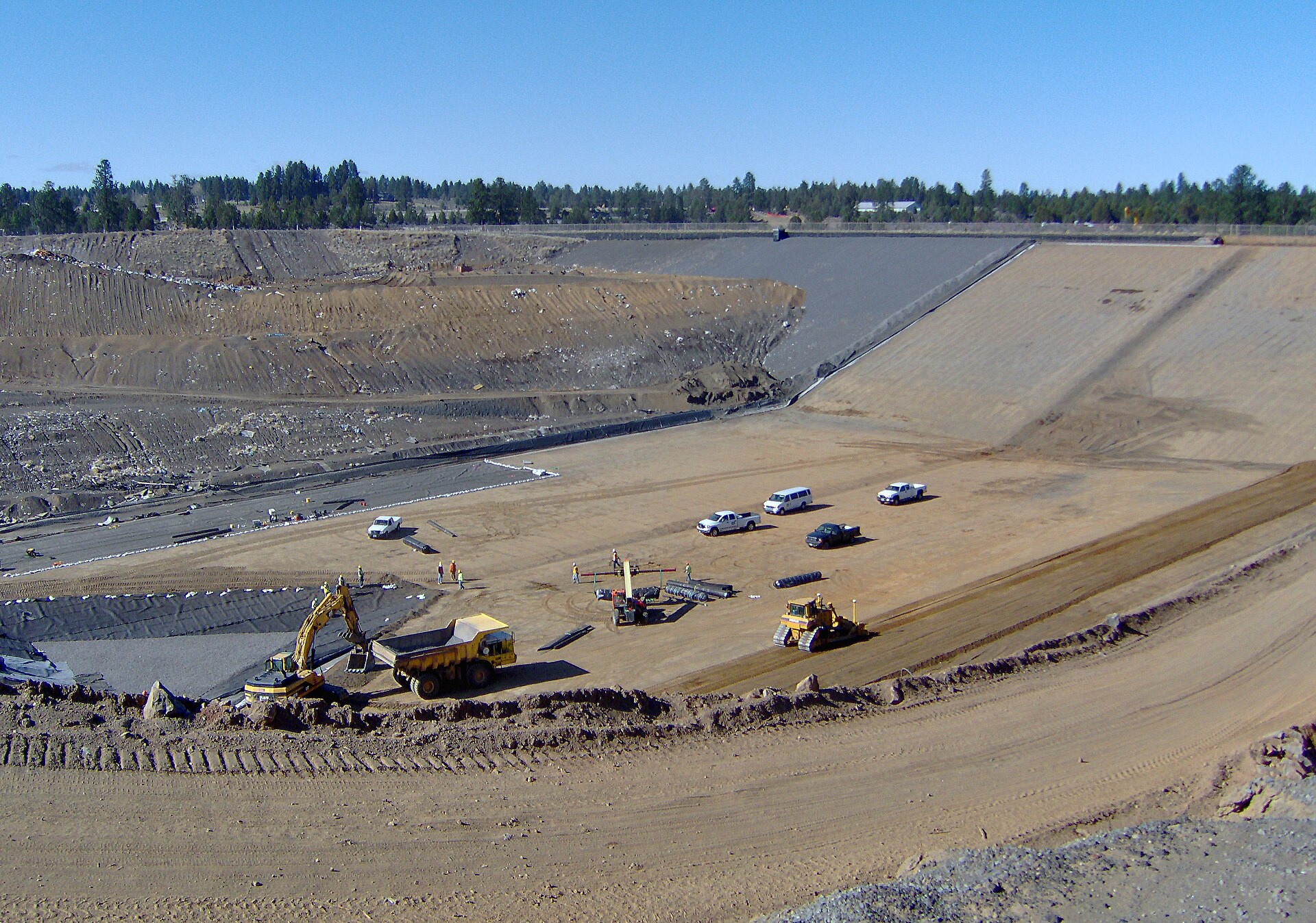 An active landfill cell. The working surface changes shape with every load tipped and every compaction pass.