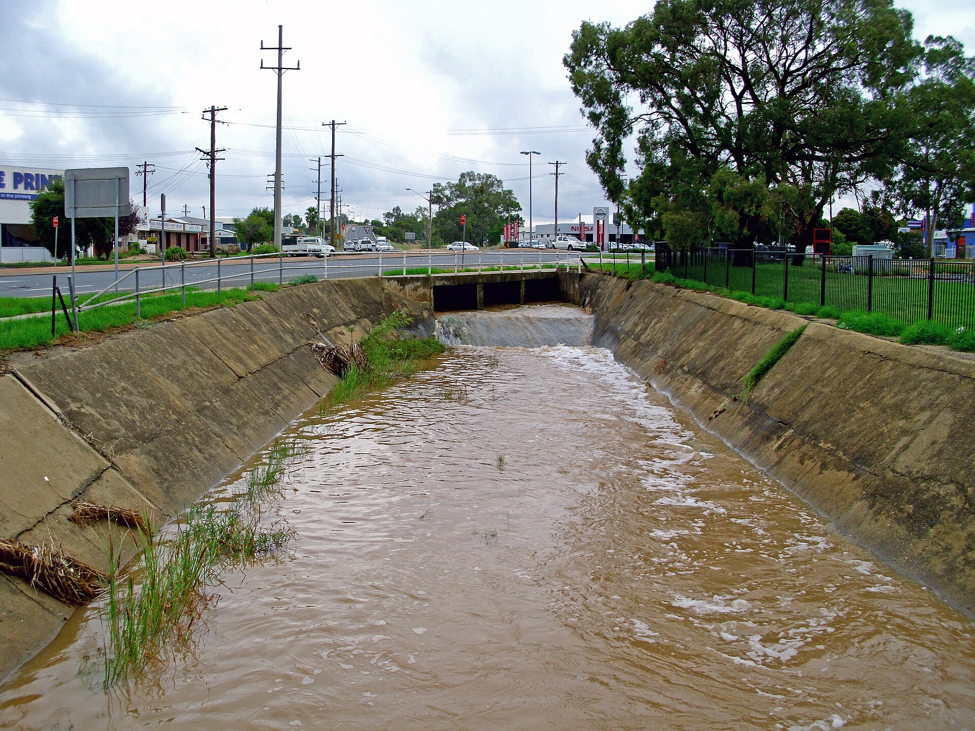Conventional stormwater outfall. Everything the catchment picked up arrives here in a few minutes.