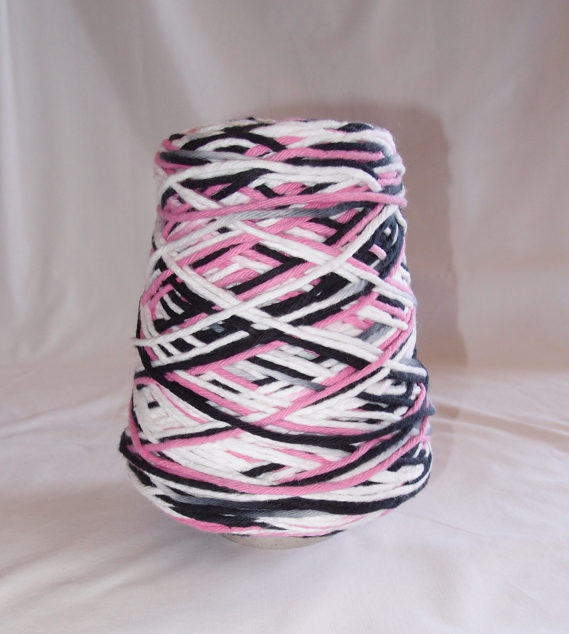 The unit of the demonstration so far: yarn on a cone. Everything downstream of this is still to come.