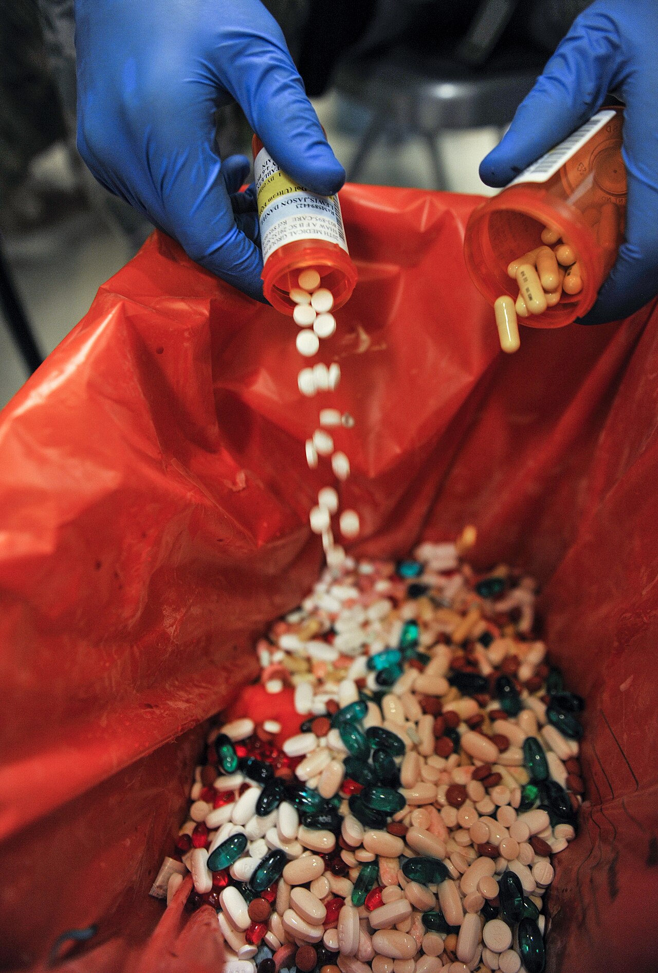 A pharmacy take-back event. Collection is the only route that keeps the active ingredient out of both sewers and landfill leachate.