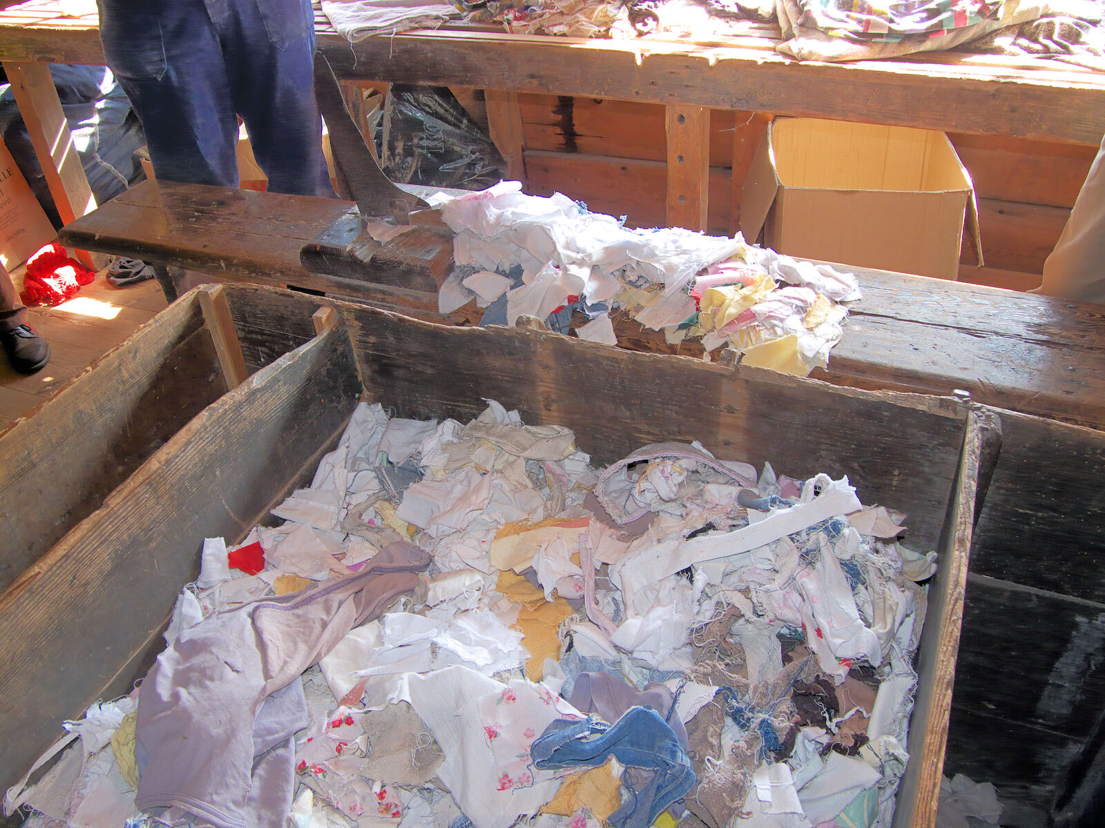 Textile sorting. Blends, dyes, elastane and trims are what make garments a chemistry problem rather than a shredding problem.